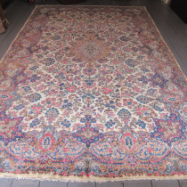 Fine Kirman Laver Carpet - This is a highly decorative carpet wuith subtle colours and an elegant design influenced by European decorative styles. In very good condition. Image of Fine Kirman Laver Carpet
