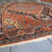 Jozan Rug - Jozan is one of the weaving towns in the Sultanabad district of West Persia, close to Sarouk. 19th century Jozan rugs share many of the characteristics of Sarouk rugs, including fine wool, and very good natural dyes. However, both the weave and the drawing of the designs tend to be more rustic which gives them a more archaic appearance. In this rug you see many of these features. The field design of concentric medallions is beautifully drawn and appears to be floating above a sapphire blue outer field. Note too the saffron yellow spandrels. The main border is also quite stunning. Expressively drawn arabesques link colourful floral blossoms in a chain that frames the field. Its a charming composition. In great original condition and professionally cleaned. Image of Jozan Rug
