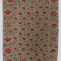 Gemlike Miniature Suzani - Occasionally, something special passes through my hands which reminds me how lovely the world of antiques and rugs is. This Bokhara Suzani hits the spot. Its a miniature size, smaller than a Nim-Suzani, and yet the balance and scale of the design is absolutely wonderful. There is a very subtle range of colours with a varied array of flowers, and the design flows elegantly through the field, linked by gold tendrils and leaves in shades of green and blue. The embroiderer even managed to include one or two little additional floral elements, if one looks carefully. The field composition is framed by an equally elegant border with larger scale floral ornaments and a wonderful flowing green leafy arabesque which runs around the entire composition. If there was ever a suzani that was made as a dowry piece this would surely be it.  Cherished throughout the generations, it has survived in excellent condition and with no visible staining. As an added bonus, it has three different pieces of old chintz lining on the back. Totally charismatic, this suzani is both highly collectible and decorative. Image of Gemlike Miniature Suzani