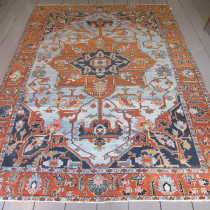 Special North-West Persian Carpet - This rare beauty was woven in North-West Persia around 1890 yet feels so contemporary. Interestingly, although it has the structure and central medallion one sees in many Heriz carpets from that region, I hesitate to ascribe that title to it. Why? There are a few good reasons. First, the wool quality is very soft and velvety with a lovely sheen that one does not see in Heriz carpets. Second, the sky-blue field is extremely rare. Indeed the entire colour palette with subtle greys, sapphire blues, dark terracottas and sharp pinks have been combined in striking ways that are a feast for the eye, but also very 'un-Heriz-like'. Finally, the delightful terracotta border is filled with palmettes and leaves drawn in quite a naturalistic fashion. In any event, this is a supremely decorative carpet in a great size that would work in so many settings both contemporary and traditional. The light blue field feels fresh and modern, and the design although quite formal, could fit in anywhere. Professionally cleaned, and with lovely soft velvety pile, this carpet is tactile as well as decorative. Image of Special North-West Persian Carpet